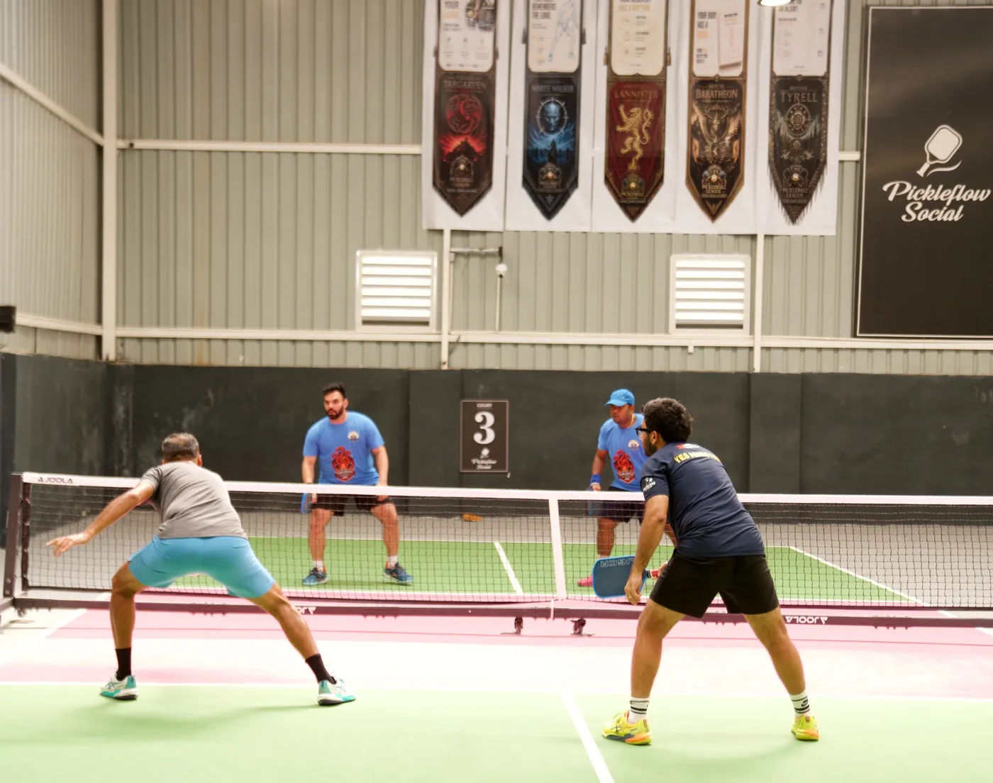 Doubles match under house banners